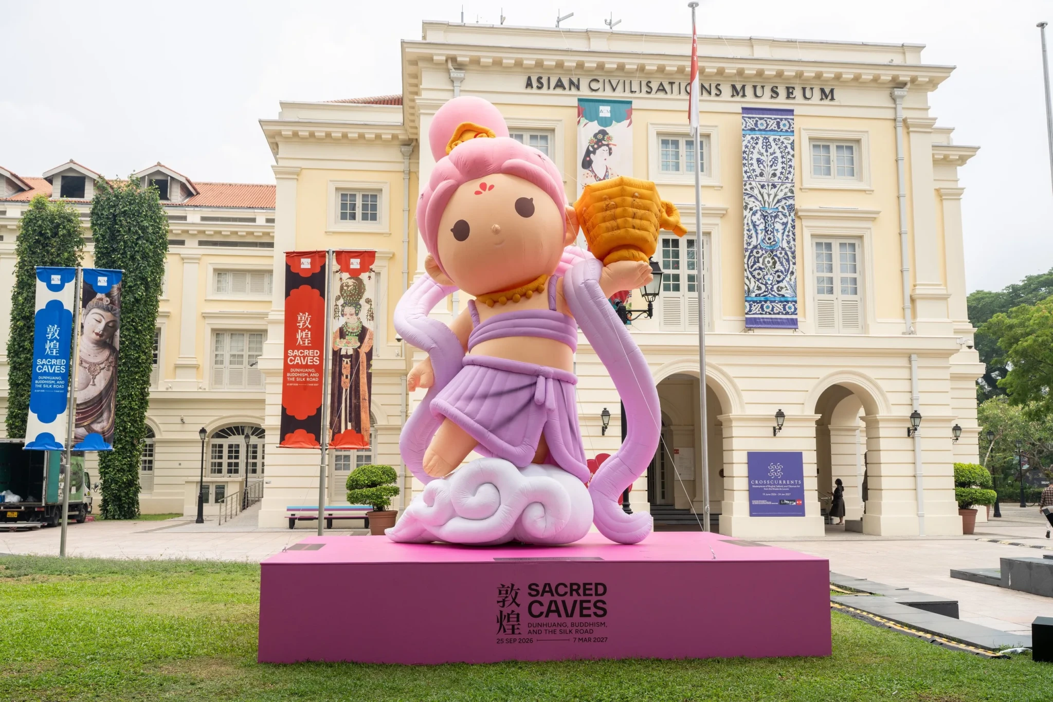 Inflatable apsara sculpture on ACM Green with Asian Civilisations Museum building behind