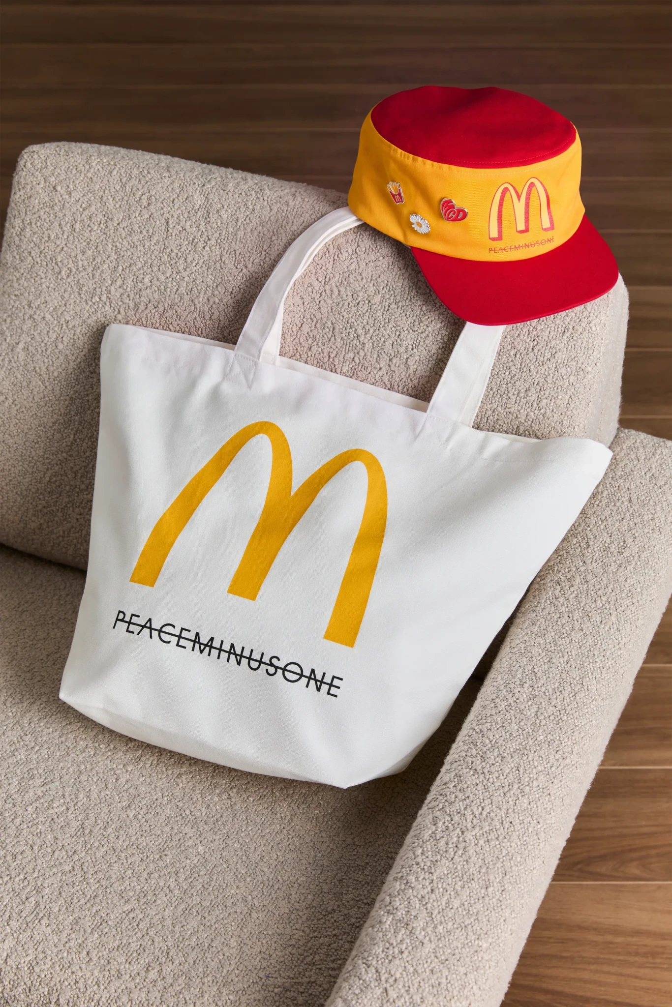 PEACEMINUSONE tote bag and vintage hat from McDonald's Singapore displayed on a chair