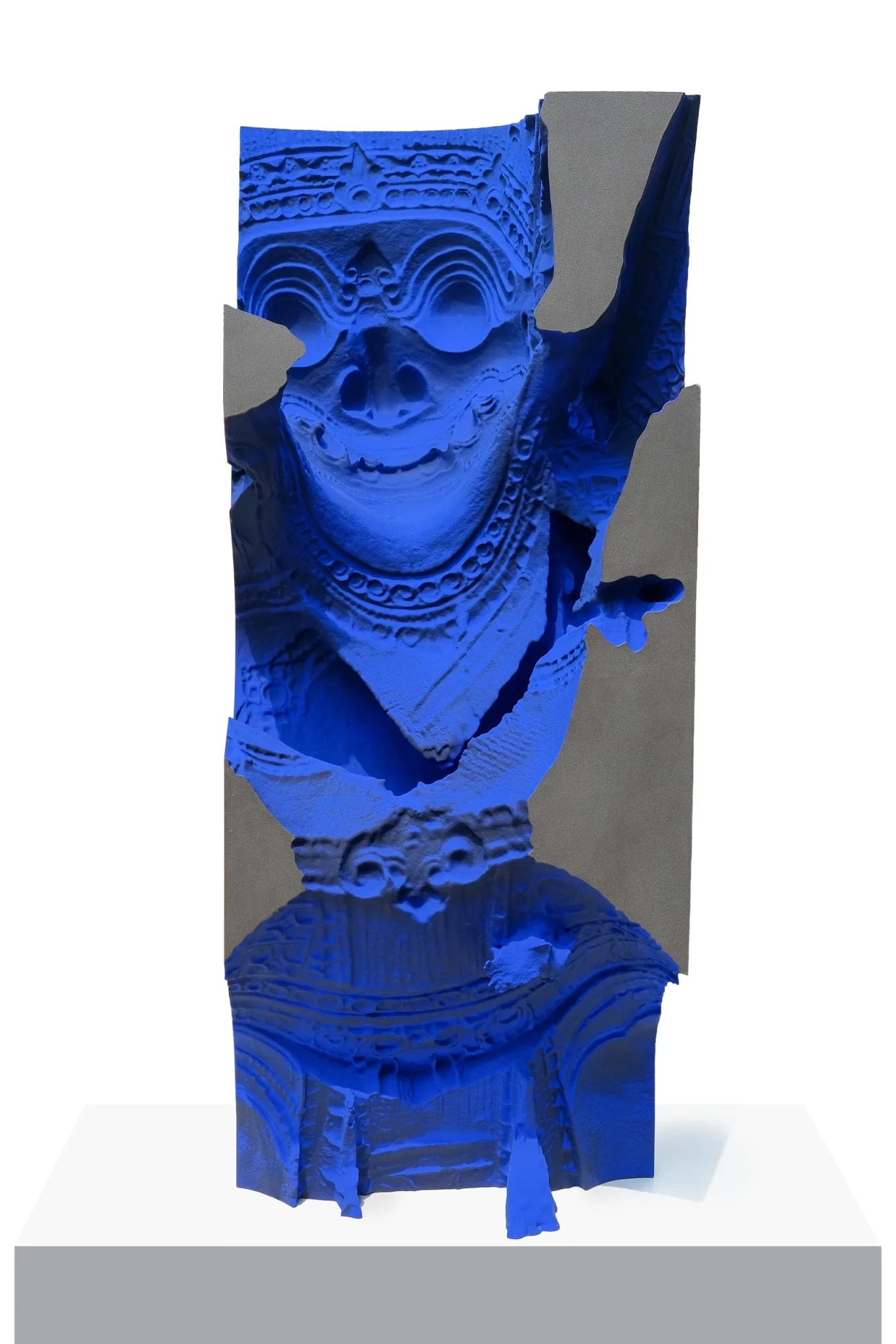 3D-printed sculpture with ornamental details broken up by fragmented bright blue sections