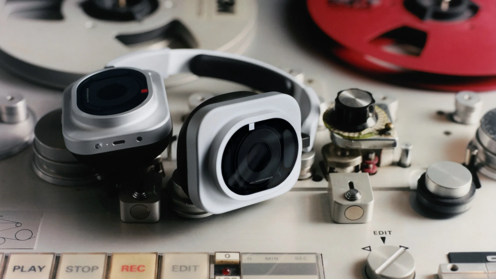 White Nothing Headphone (1) Pro headphones with internal parts and control buttons on a light surface
