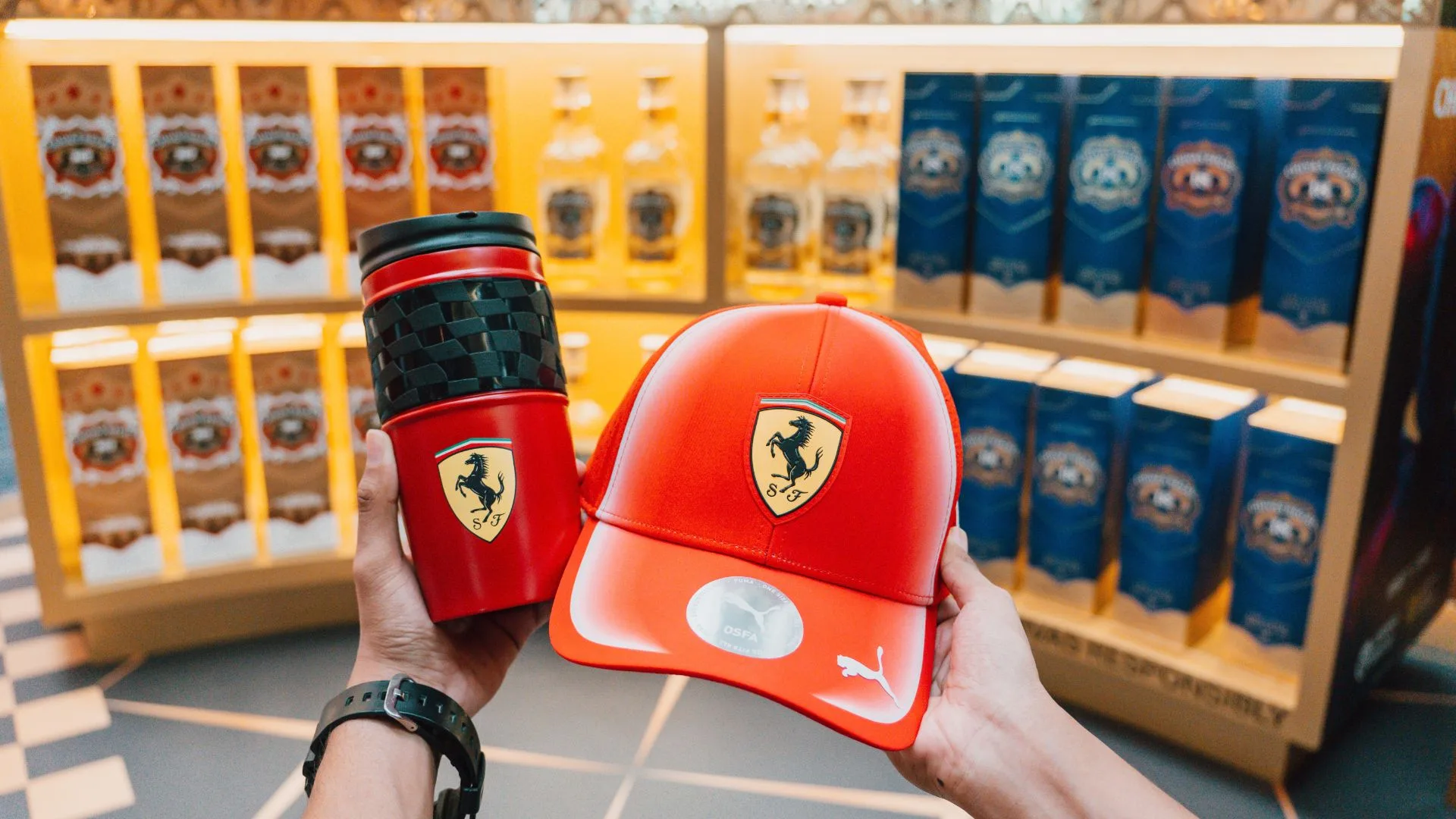 Red Chivas Regal tumbler and cap carrying the Ferrari Prancing Horse logo