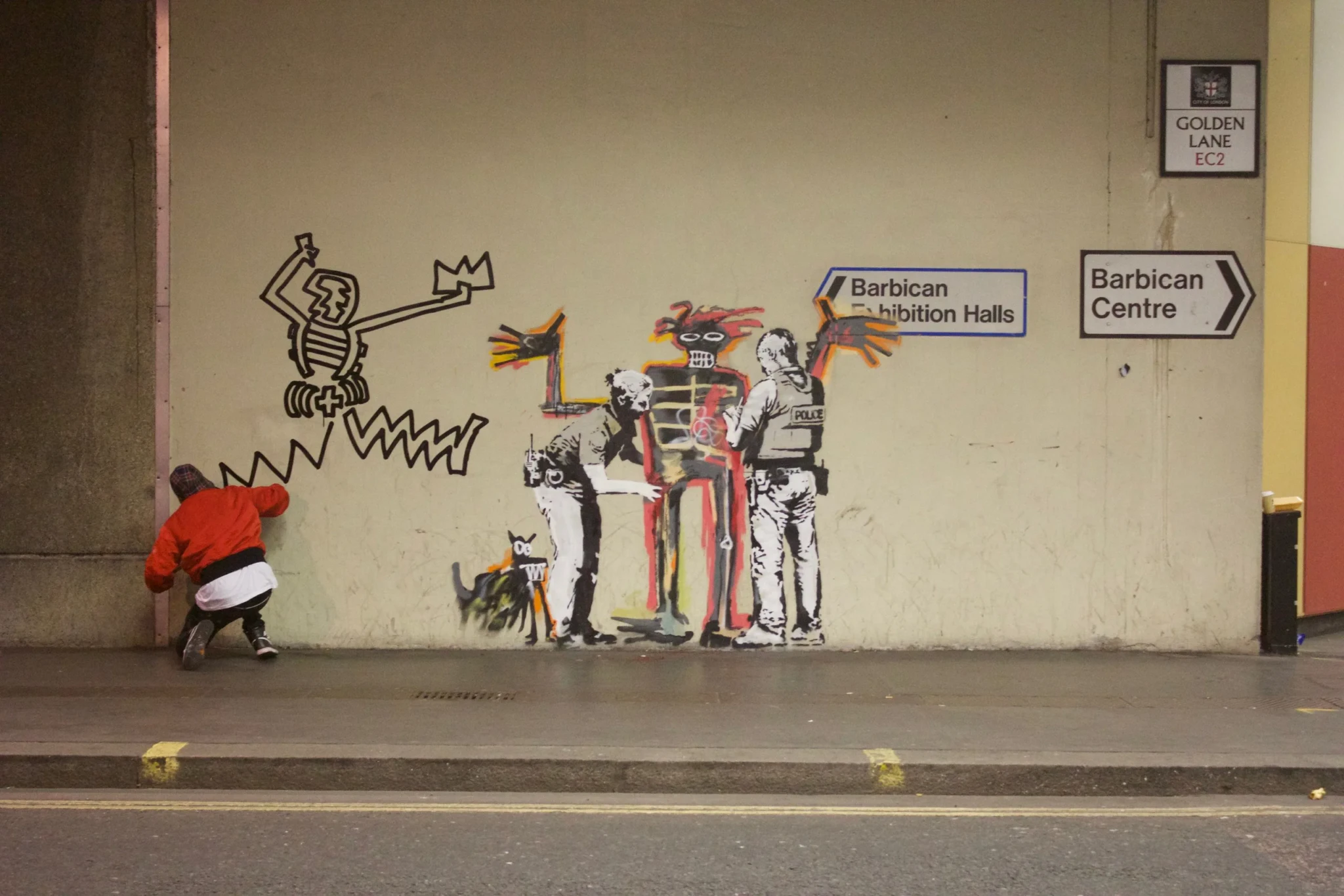 Danny Minnick's skeletal 'Character' figure painted on a wall beneath London's Barbican Centre