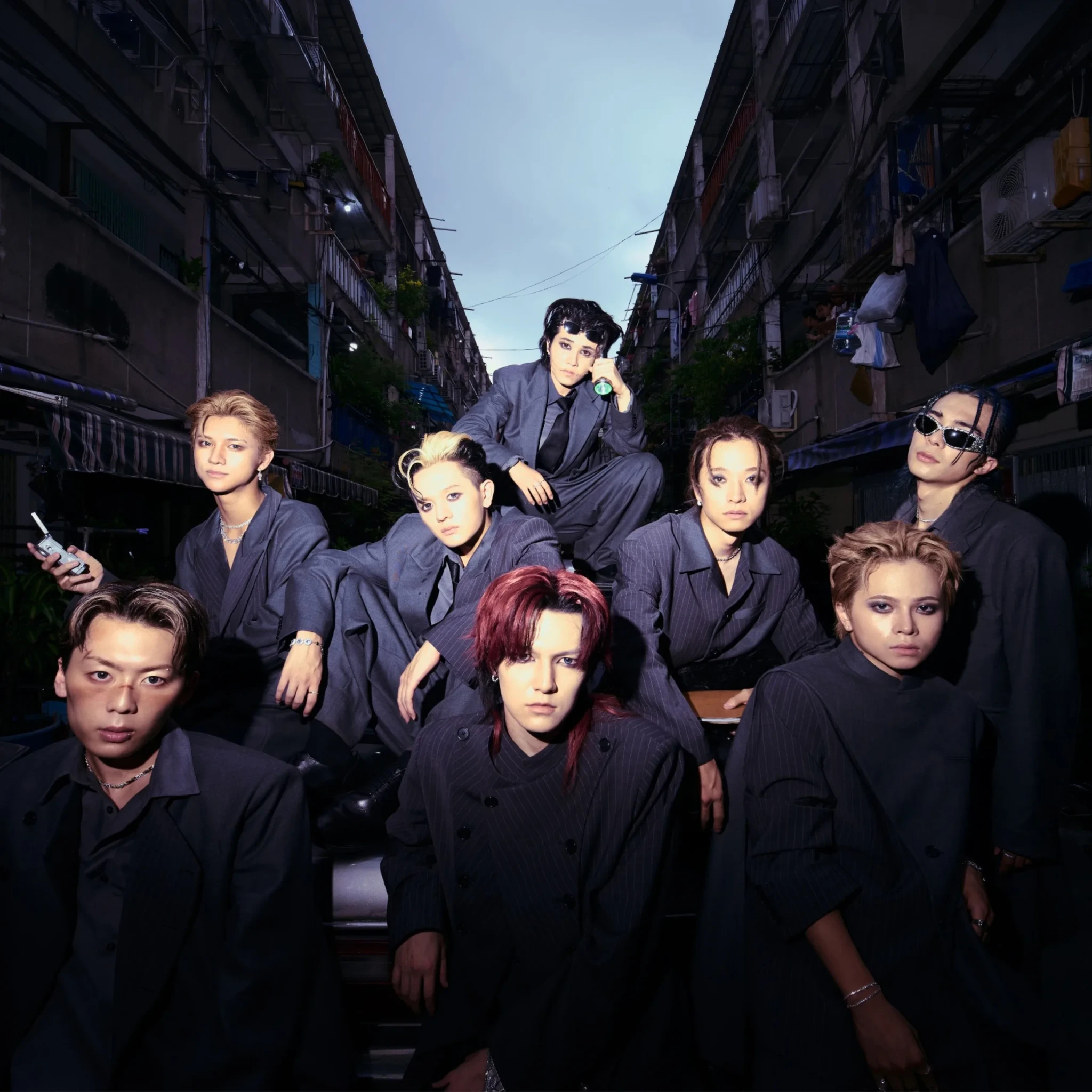 SOUMA and TAIKI with members of ONE OR EIGHT and STARGLOW in an urban alleyway