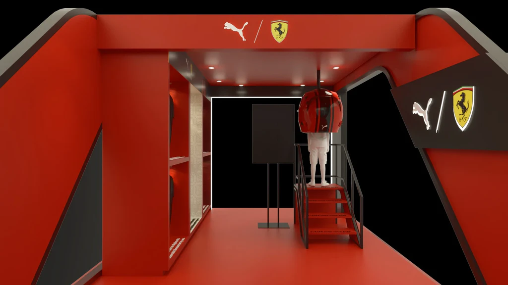 Larger-than-life helmet display beside the racing simulator, branded with PUMA and Ferrari logos