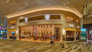 The TWG Tea Gallery at Changi Airport Terminal 3 with its curved 23-foot-high ceiling and shelves of antique tea wares