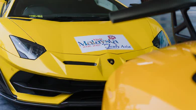 Yellow Lamborghinis carrying Visit Malaysia 2026-2027 campaign stickers in the Konvoi Eksklusif Lamborghini 2026 convoy