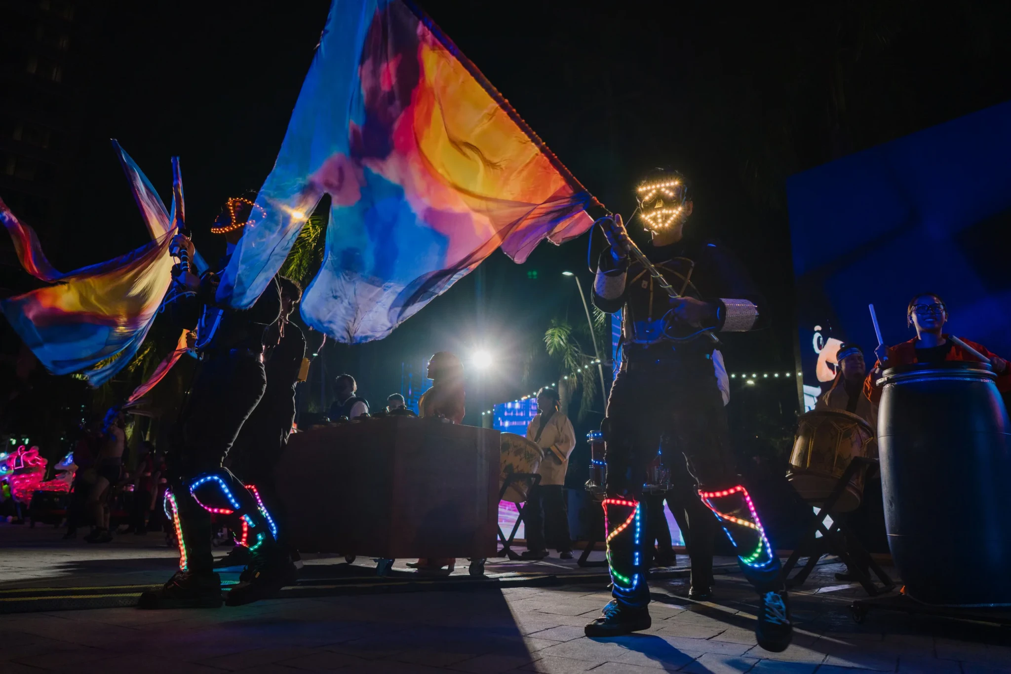 Performers waving rainbow-coloured flags during the Colours of Parade at IOI City Mall Putrajaya