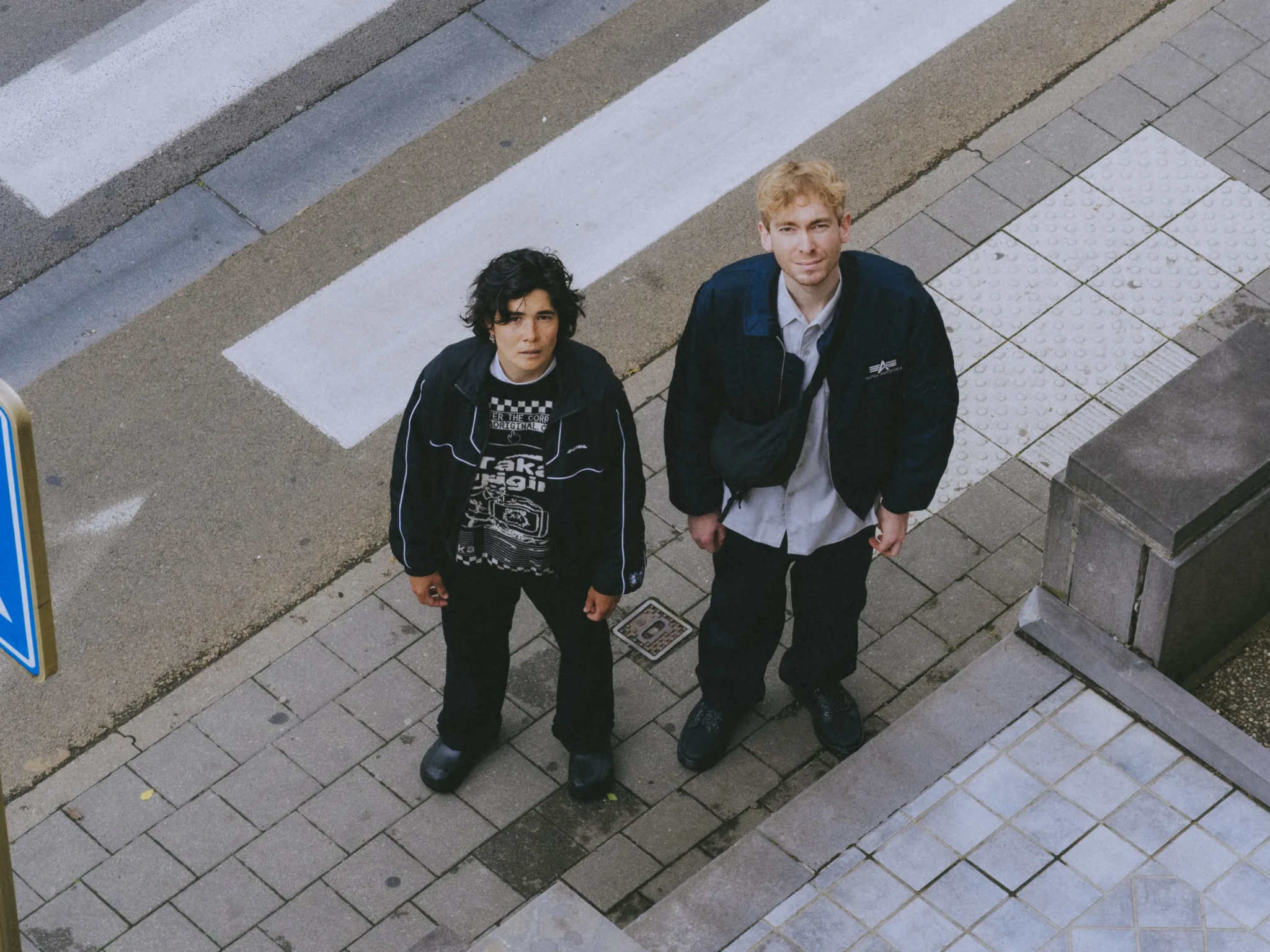 Aili & Orson photographed from above on a paved street