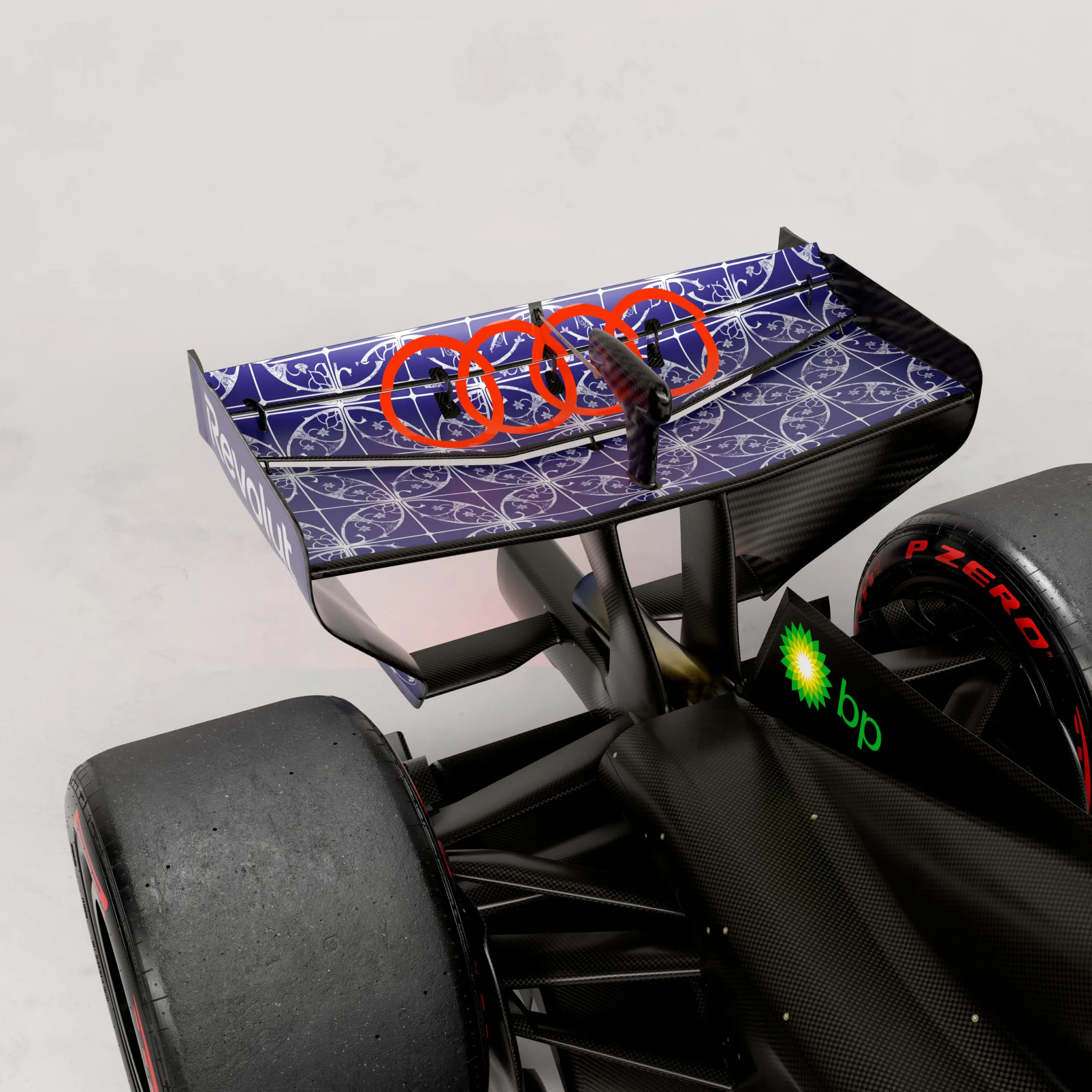 A close view of the Audi R26 with the blue and white Peranakan pattern, red suspension components, and a BP-branded tyre