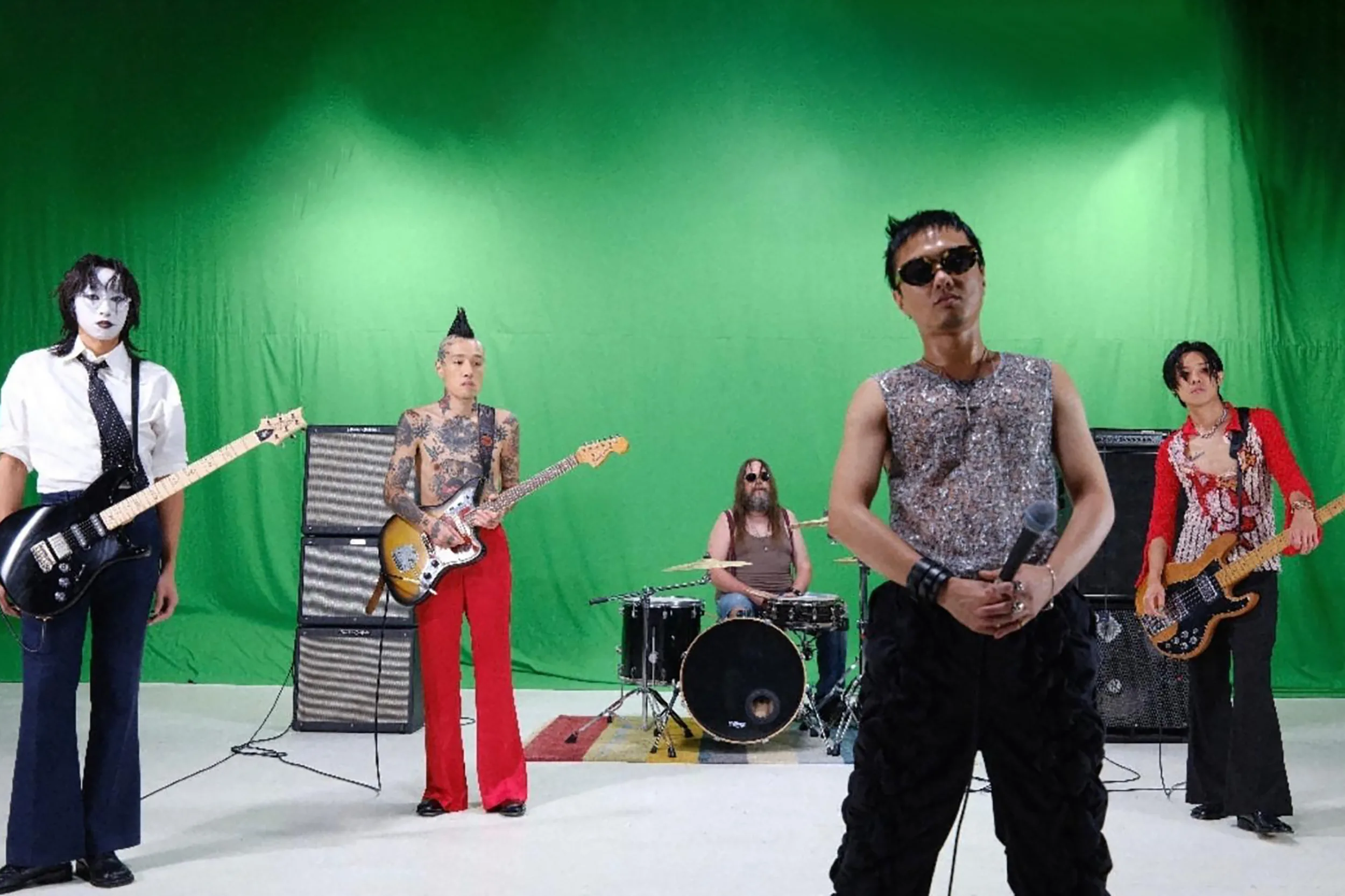 N.Y.P.D. performing as a five-piece in front of a green screen