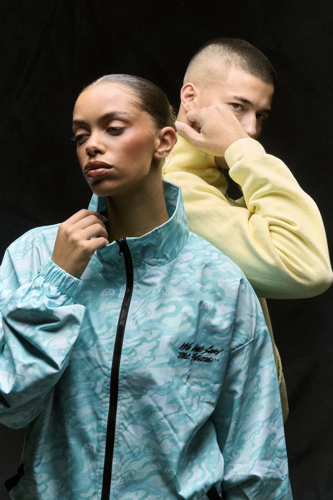 Lewis Hamilton wearing a patterned +44 jacket