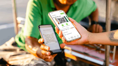 The Wise app's QR payment feature being demonstrated on a phone