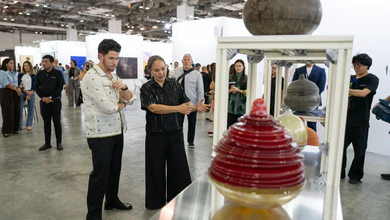 Visitors looking at stacked ceramic vessels by Pinaree Sanpitak at ART SG 2026