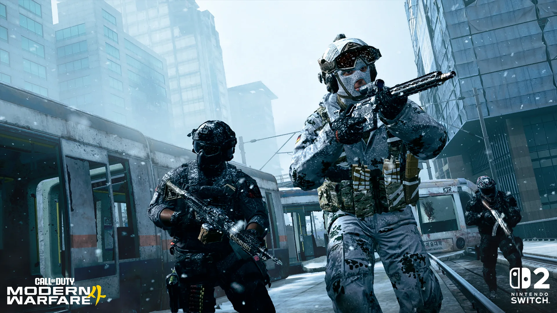 Three operators, one in white snow camouflage, advancing along snow-covered rail tracks beside a derelict train in Hajin