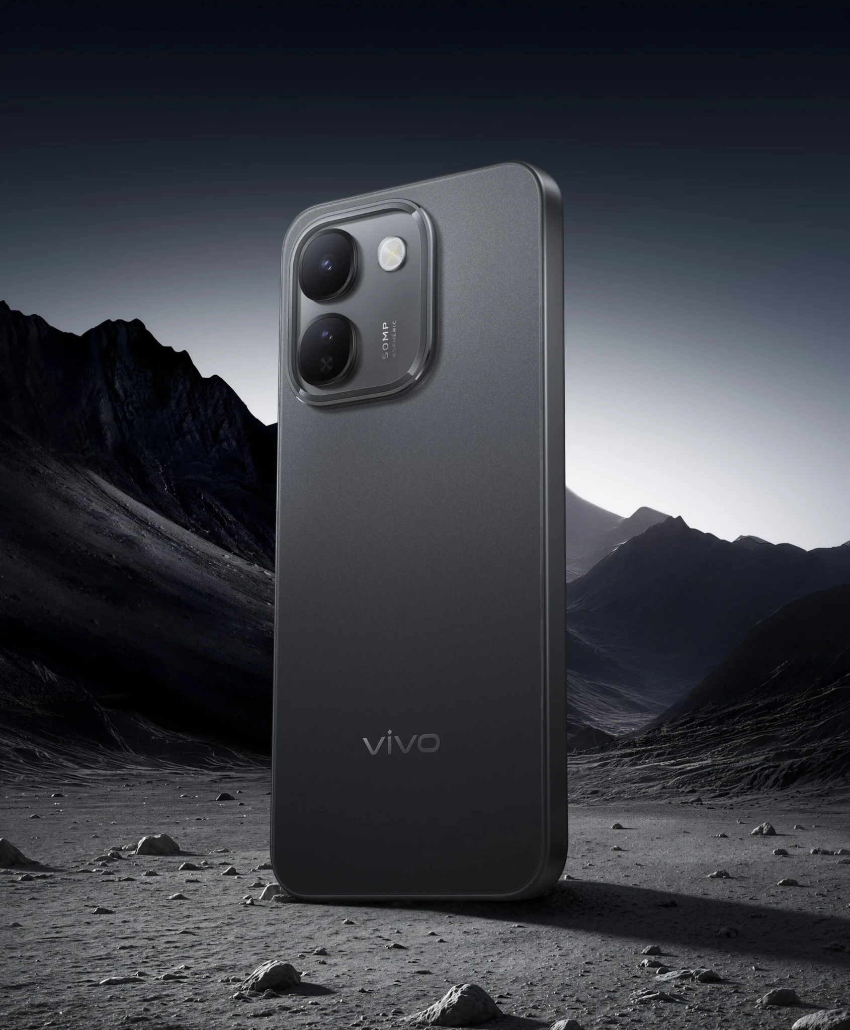 vivo V80 Lite 5G in Dawn Black on a rocky landscape