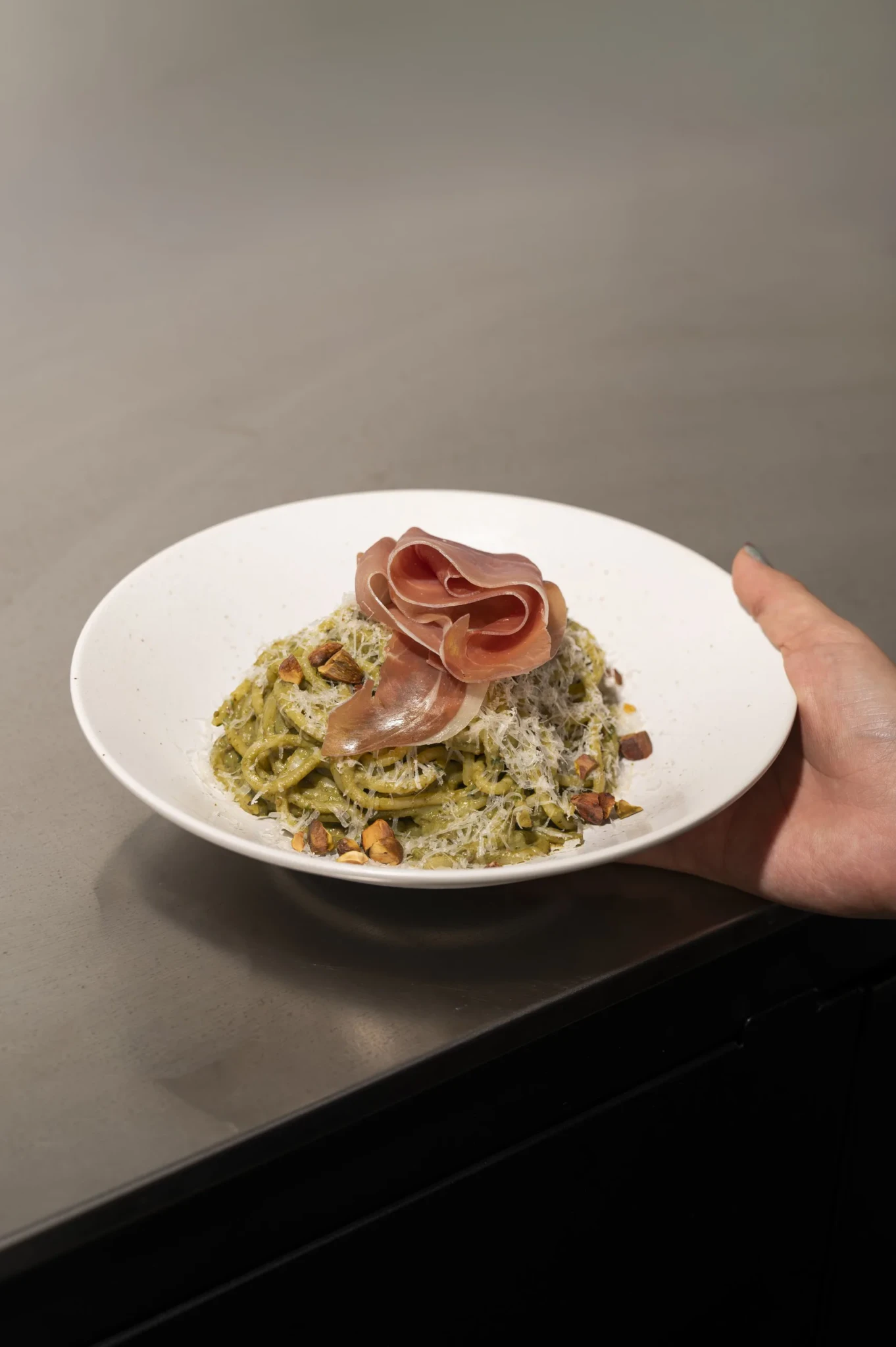 PPP aka Pistachio Pesto Pasta topped with prosciutto and toasted hazelnuts