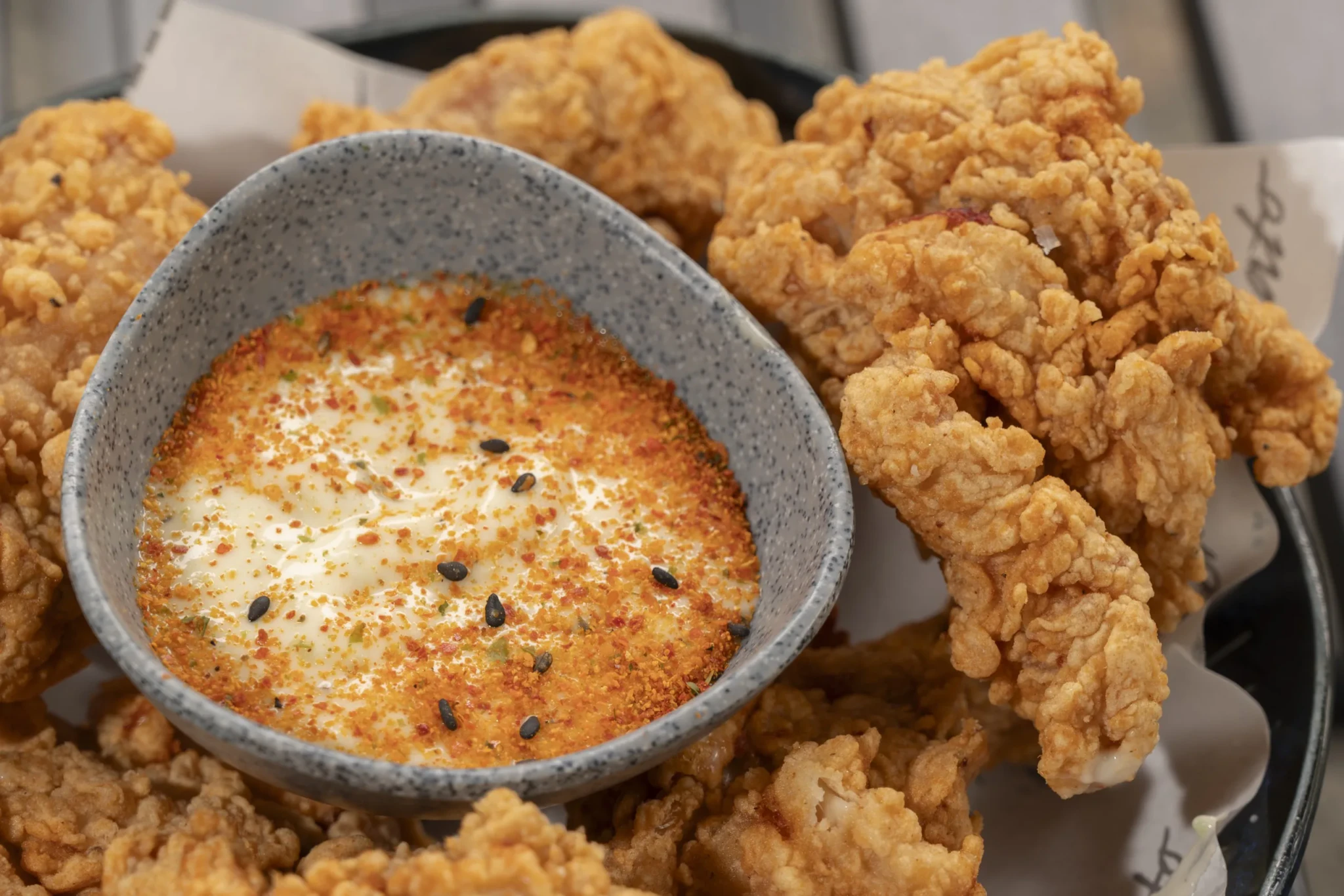 Arigato Fried Chicken served with a dipping sauce