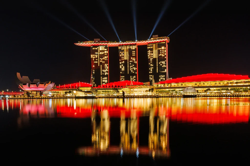 Marina Bay Sands lit red at night.