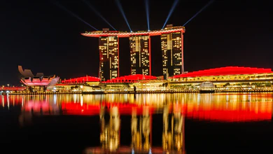 Marina Bay Sands lit red at night.