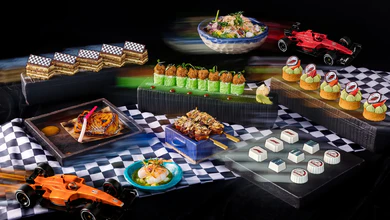 SUSHISAMBA Singapore's race-themed brunch spread, arranged with chequered cloth and model racing cars.