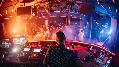 A DJ and clubgoers at CÉ LA VI Singapore