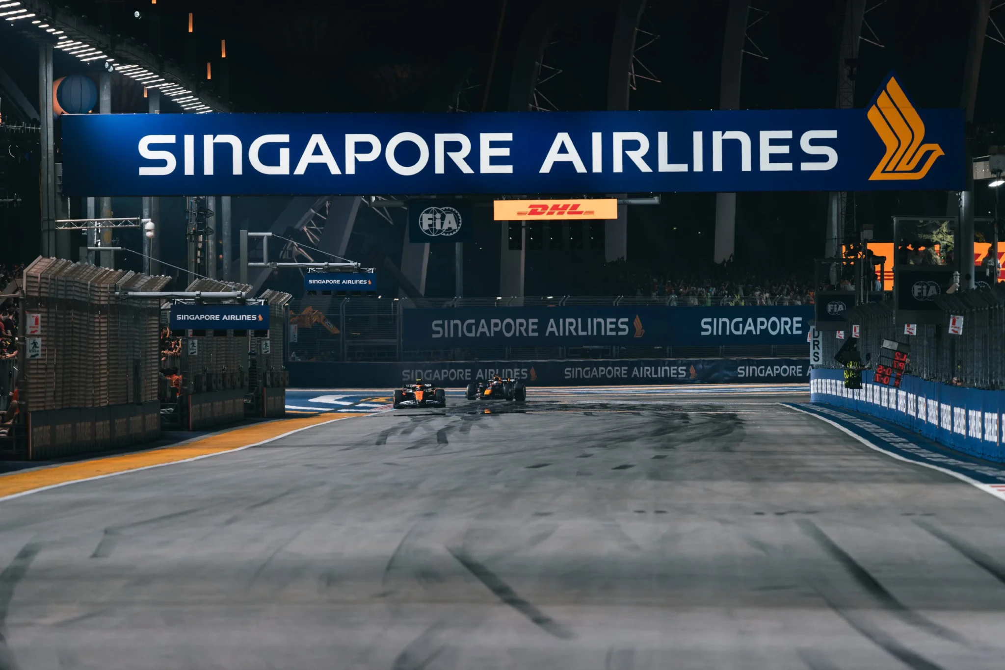 The floodlit pit straight and gantry at the Marina Bay Street Circuit at night