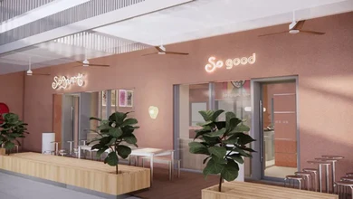 Rendering of the Sogurt storefront with glowing Sogurt and So good neon signs, wooden planters and bar stools