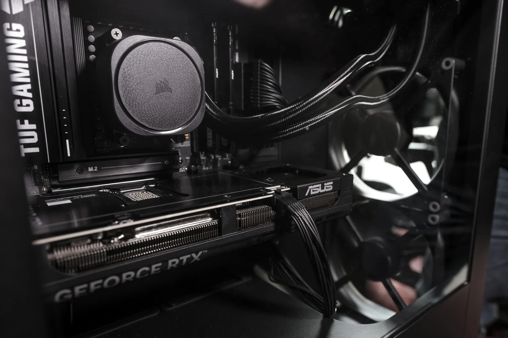 Interior of a gaming PC with liquid cooling system and ASUS components