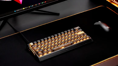 The IQUNIX EV63 EDG Edition with gold keycaps and EDG branding on a black desk mat