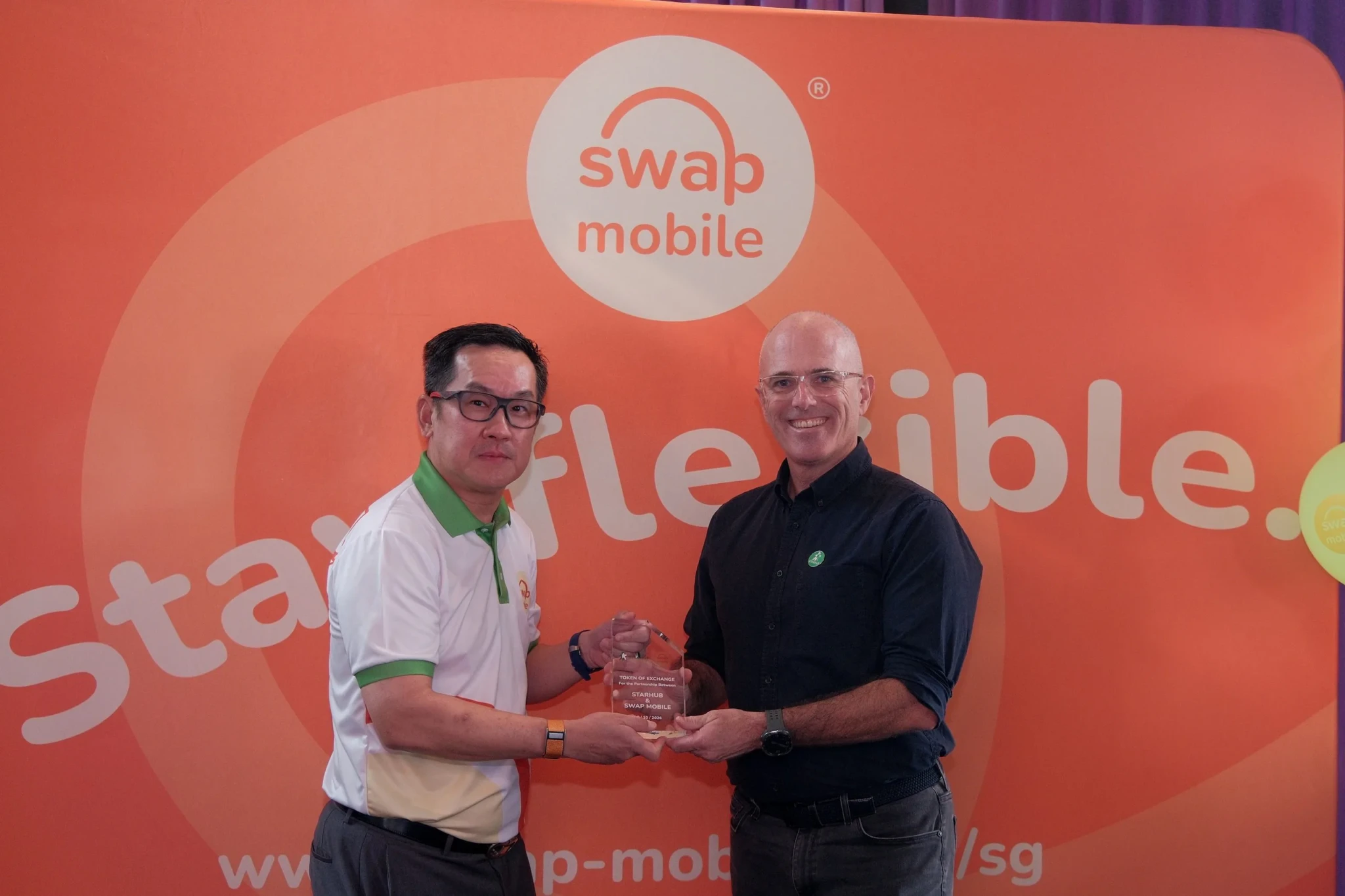A token exchange at the Swap Mobile launch event in Singapore