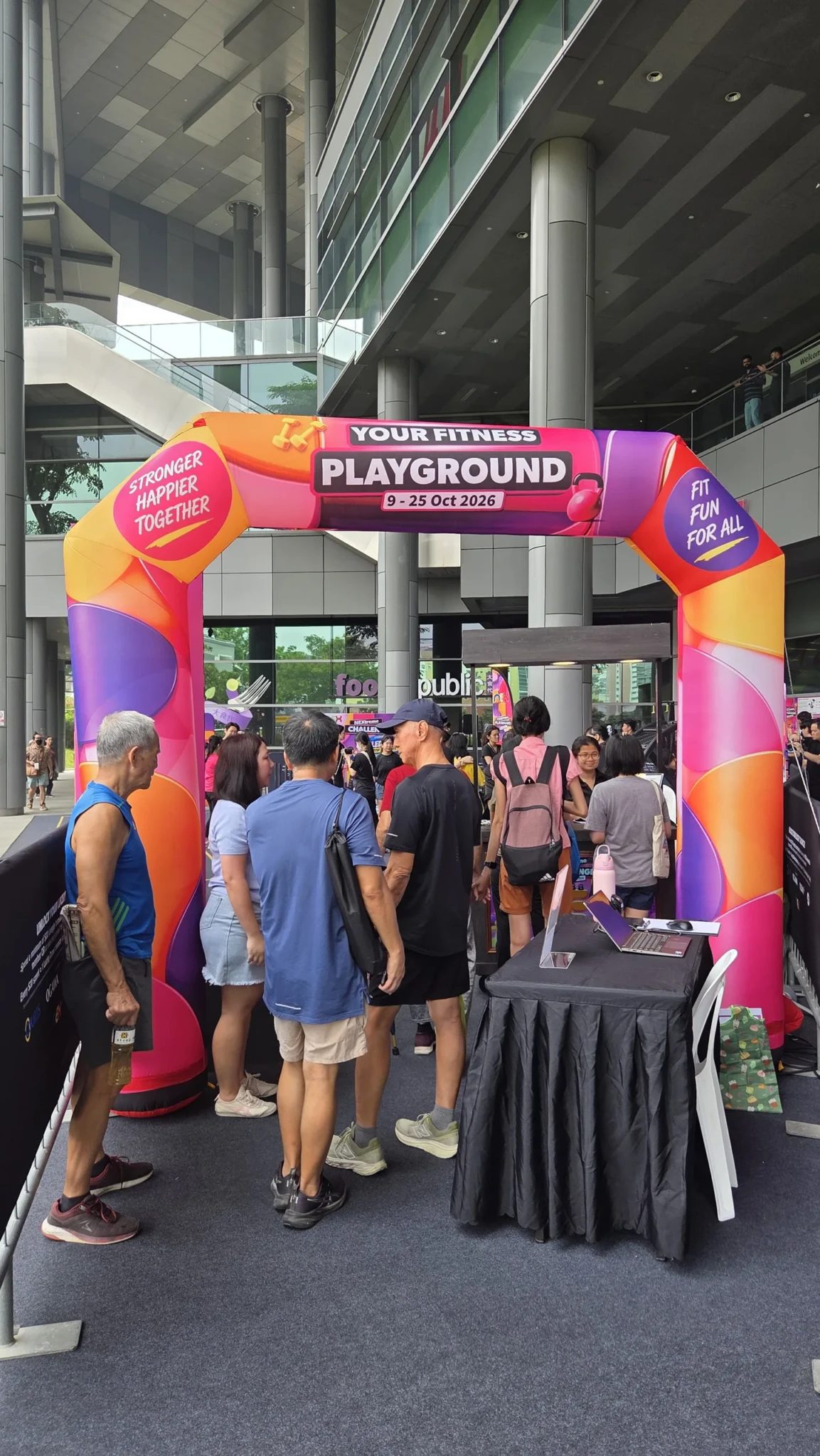 The Your Fitness Playground arch and a crowd at NEX
