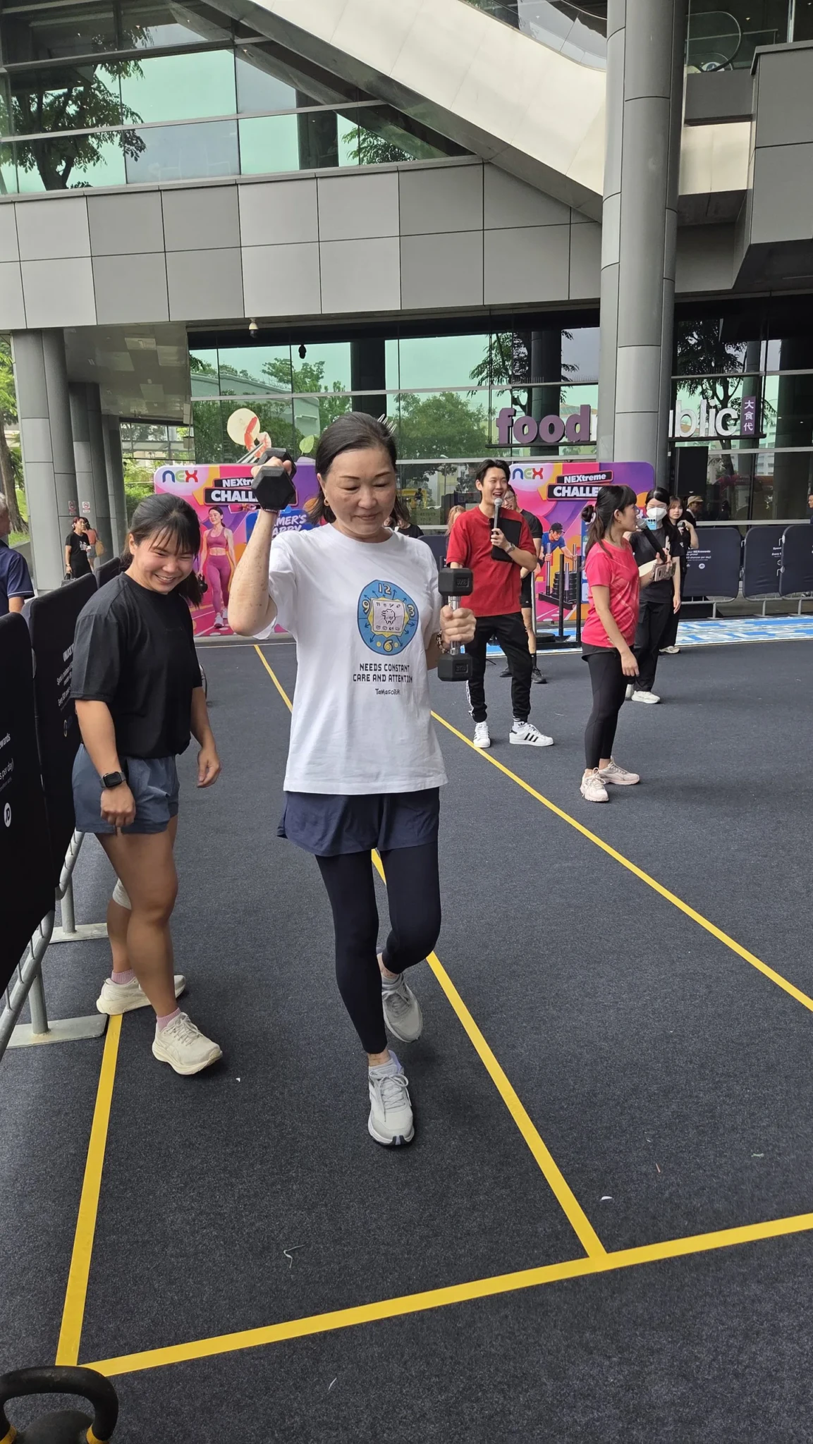 A participant takes on the Farmer's Carry lane at the NEXtreme Challenge at NEX.