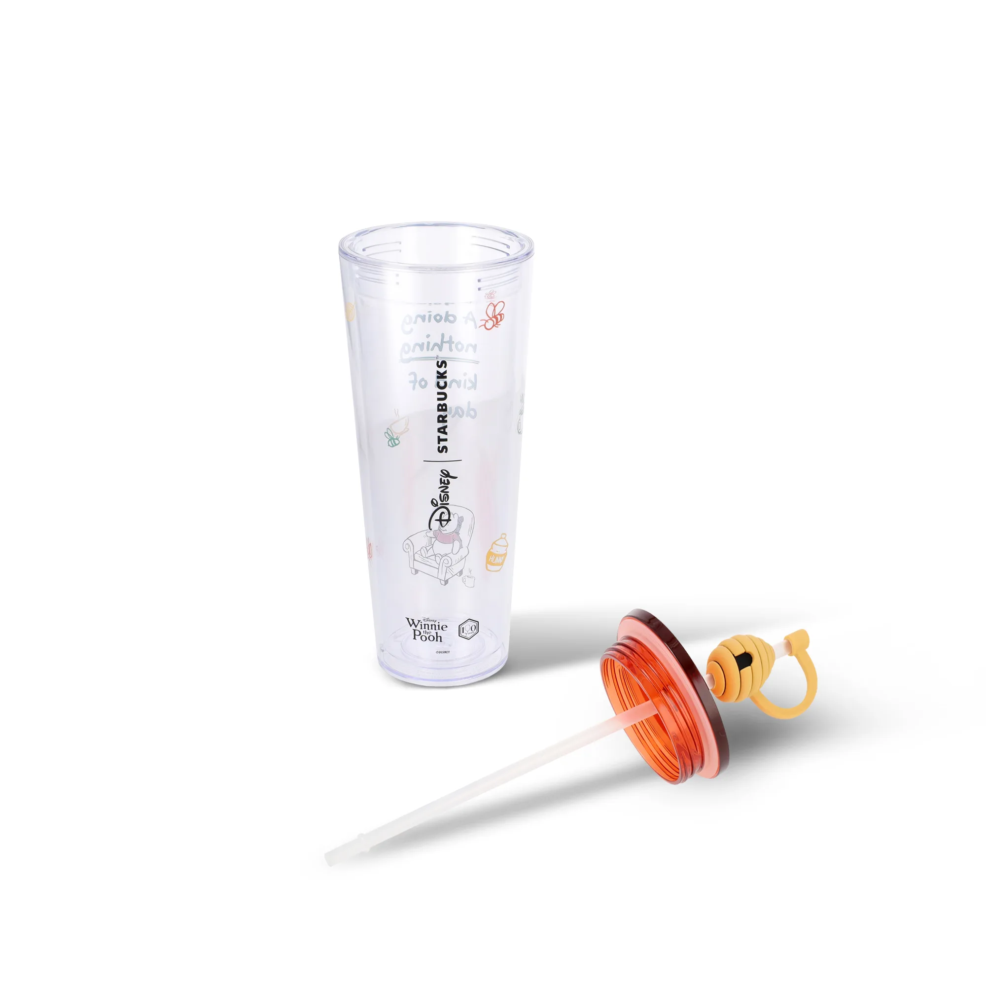 Clear Starbucks x Disney Winnie the Pooh tumbler with honey-pot straw cap and orange lid
