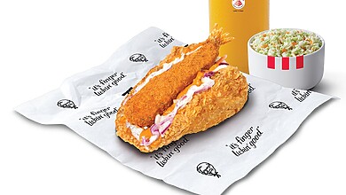 KFC Louisiana Surf N' Turf Kentaco Meal on branded paper with a drink and coleslaw