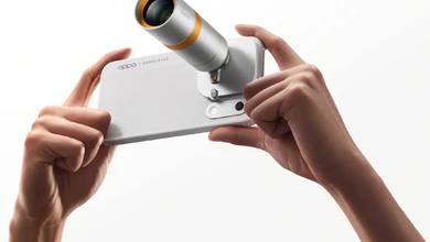 Two hands holding the OPPO Hasselblad Teleconverter attached to the back of a Find X10 Series phone