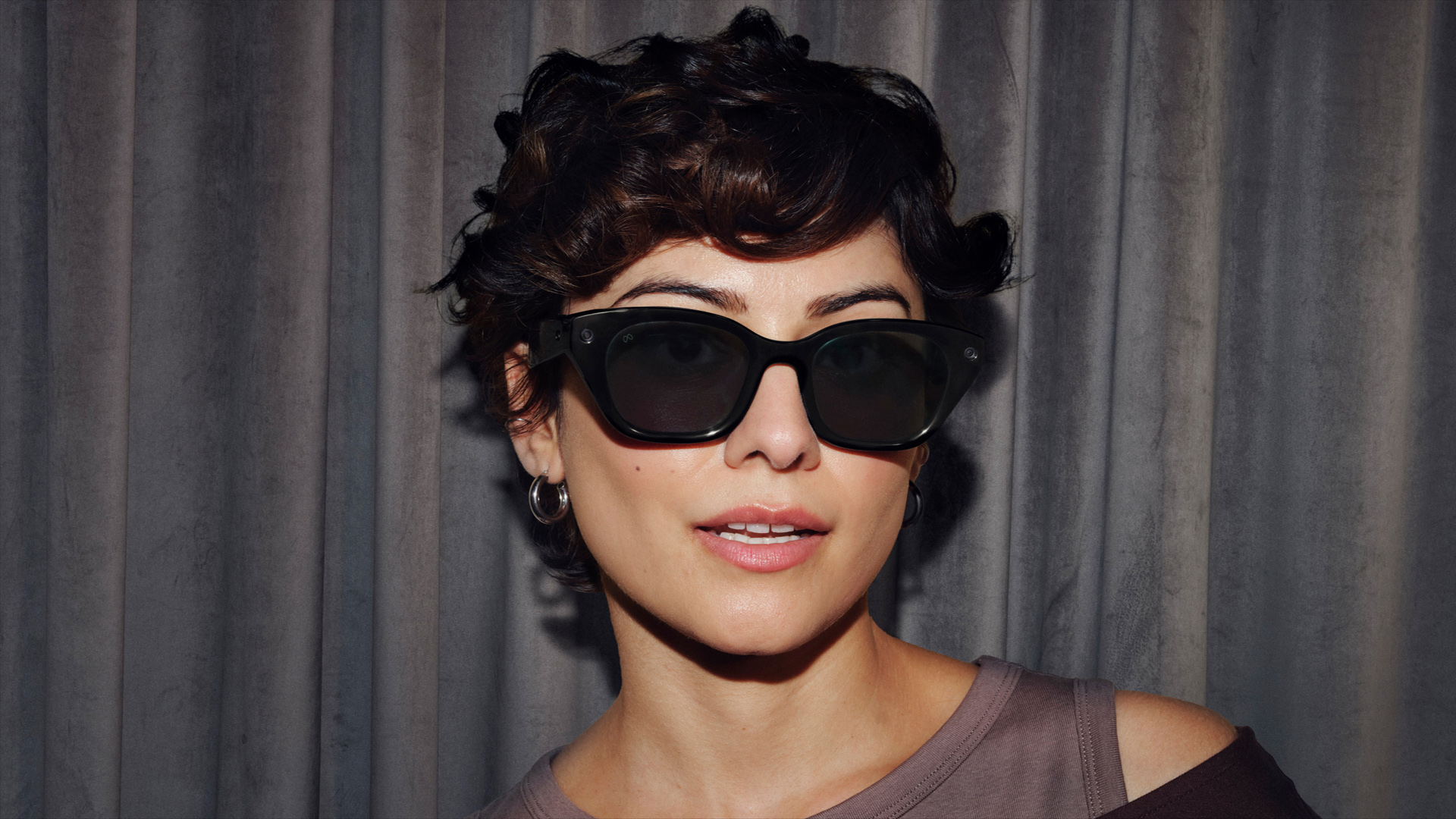 A person wearing the Meta Capri glasses.