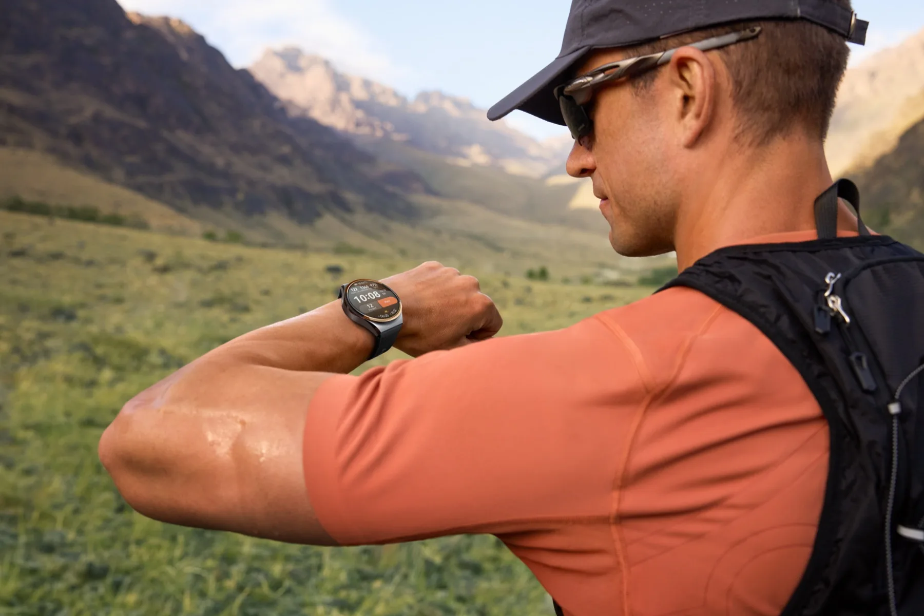 A hiker checks the HUAWEI WATCH 6 Pro 46mm on a mountain trail.