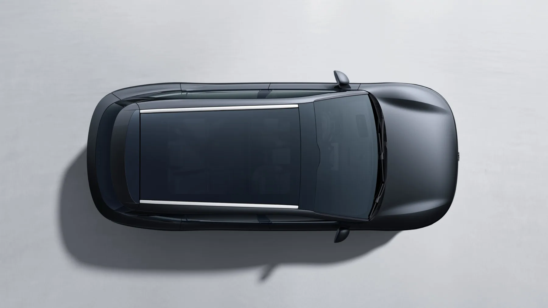 Top-down view of an Onyx Black Zeekr 7X showing its panoramic glass roof and silver roof rails