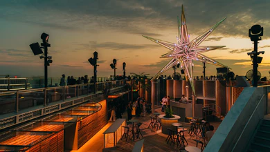 NOVA's rooftop and star sculpture at sunset.