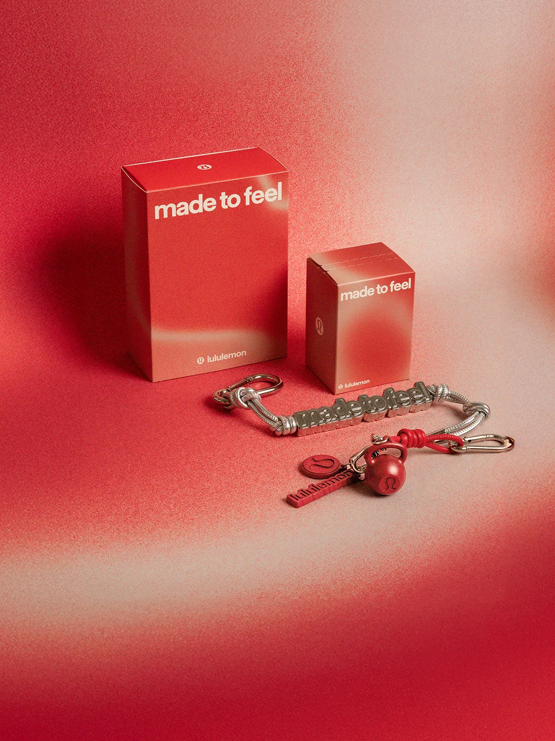 lululemon blind box packaging with red and silver keychain accessories and the made to feel tagline
