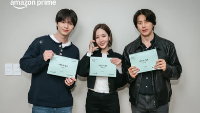 Park Min-young, Yook Sung-jae and Go Soo holding up their Nine to Six scripts in a promotional photo for Prime Video