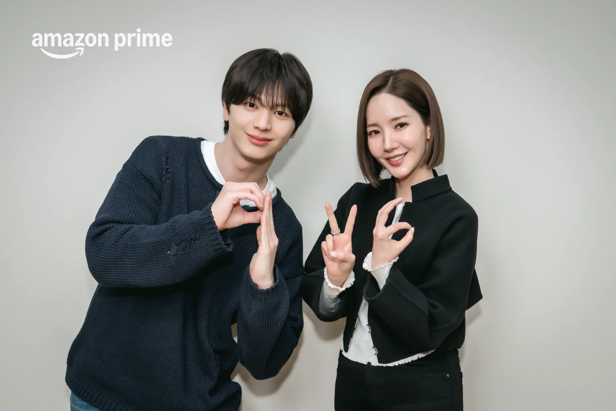 Park Min-young and Yook Sung-jae posing playfully together in a promotional photo for Nine to Six