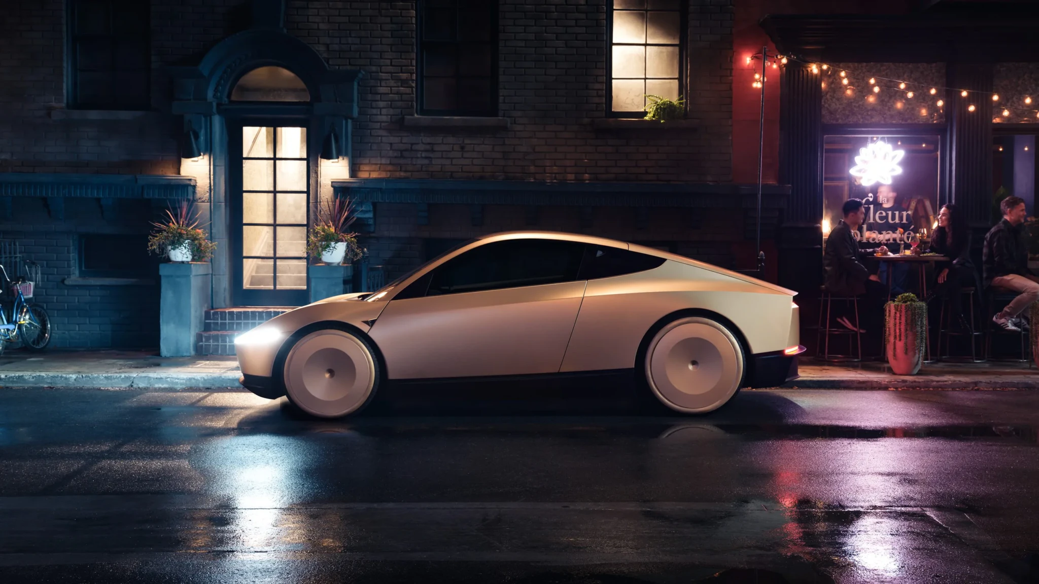 Tesla Cybercab outside a shop at night.