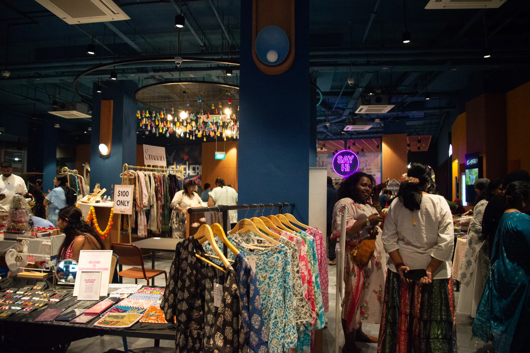 Visitors browsing homegrown Indian fashion and accessories at a stall at lyf Farrer Park