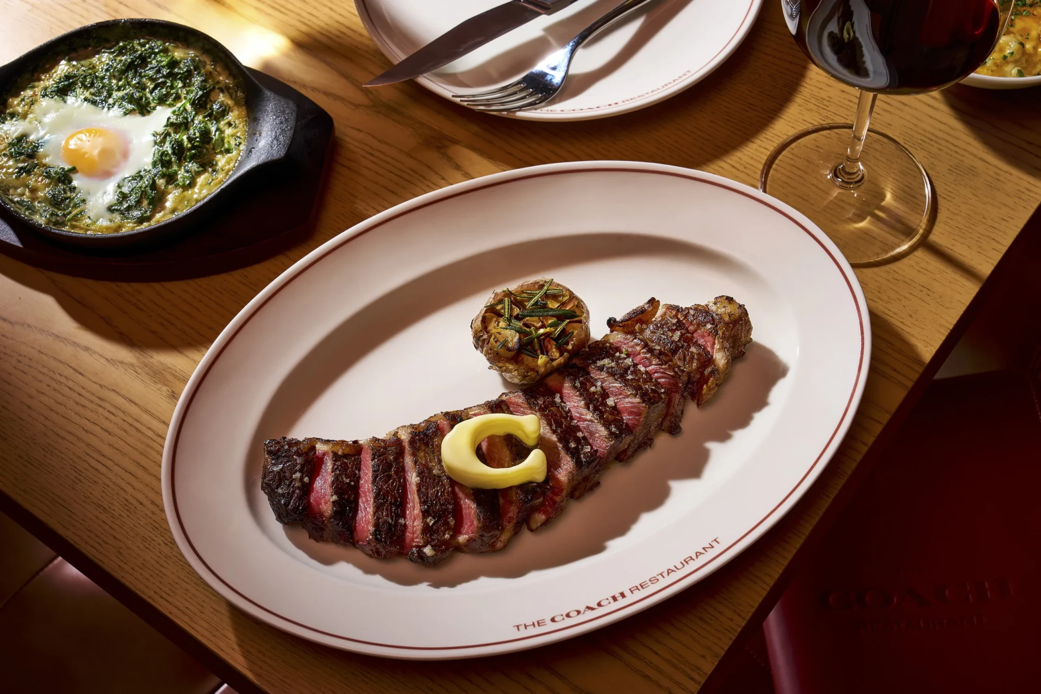 A Steak Under a Hanging Taxi: Coach Restaurant Turns One