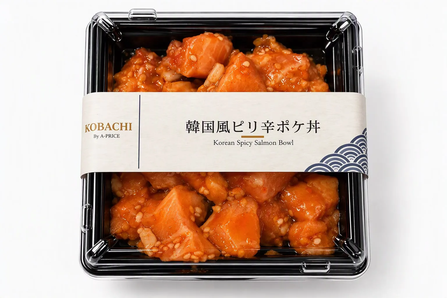 The Korean Spicy Salmon Bowl from A-PRICE, with diced salmon in spicy sauce and sesame seeds in a black container with a paper sleeve
