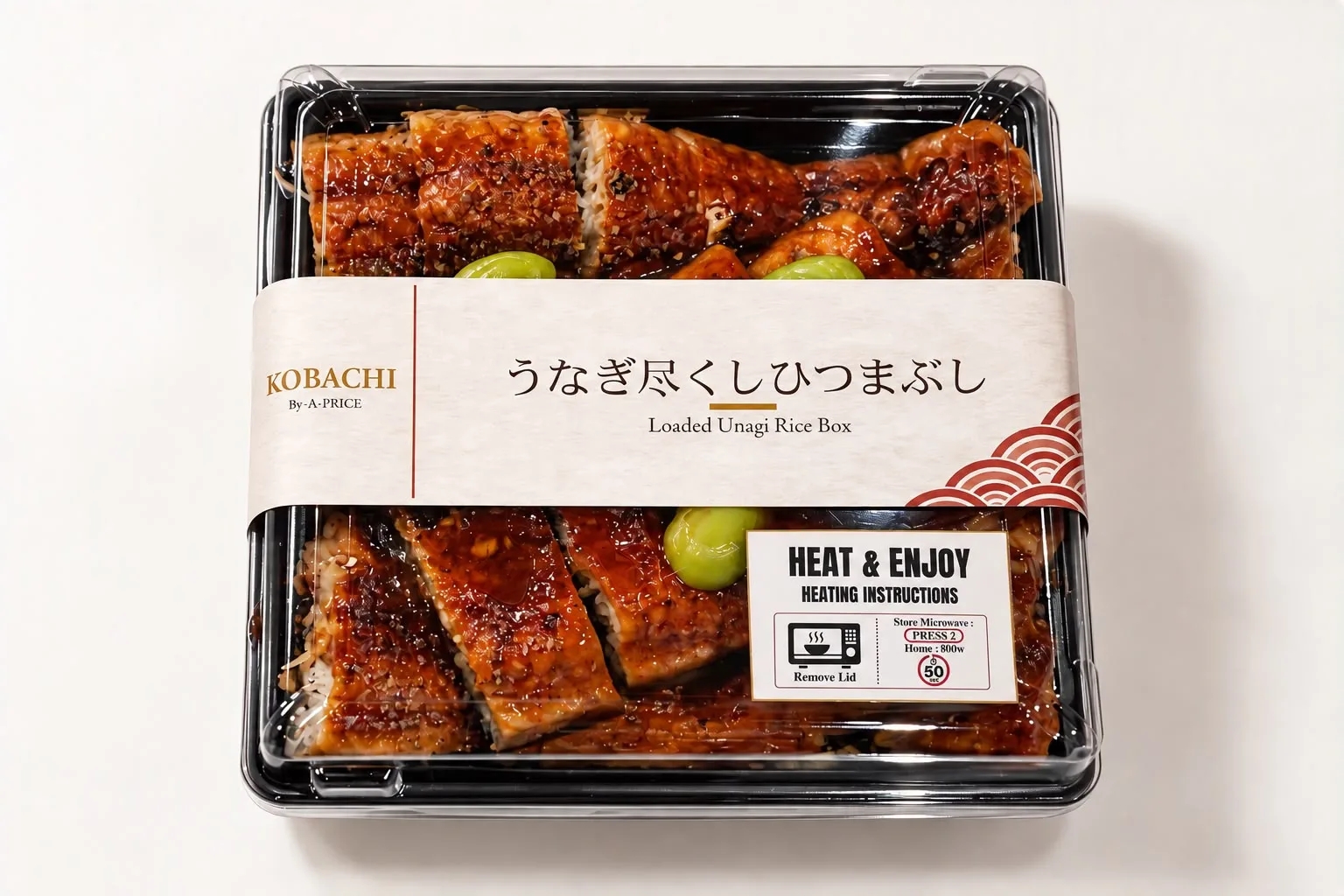 The Loaded Unagi Rice Box from A-PRICE, with grilled unagi and wasabi on rice in a black tray carrying a heating instruction label