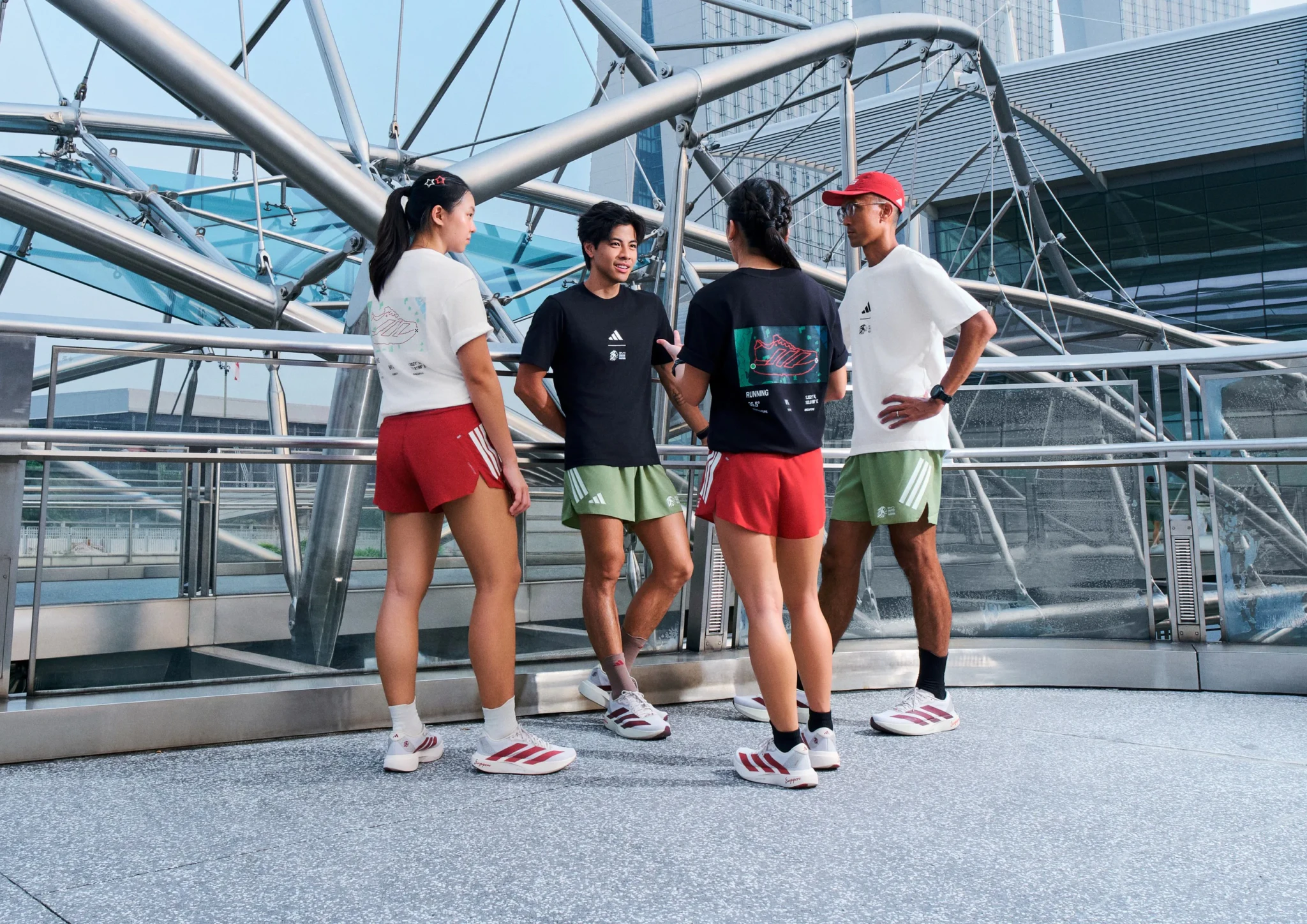 Shane Tan, Jamie Pang, Joakim Gomez, Nazri Rahman, Bernice Tan and Benjamin Kheng in adidas running apparel on a metal footbridge