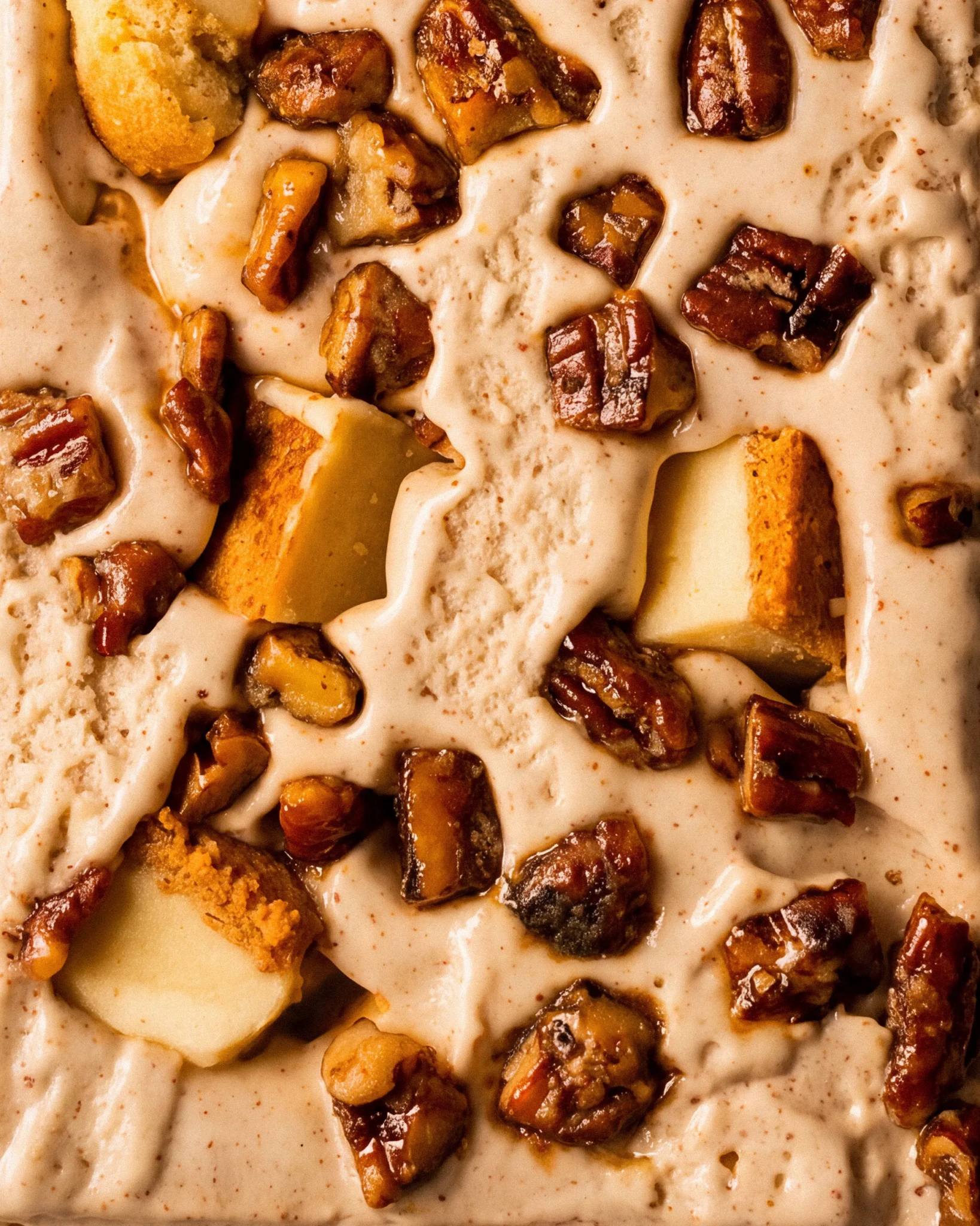 Close-up of Buttery Blue Cheese gelato studded with caramelised pecans and chunks of golden cheesecake