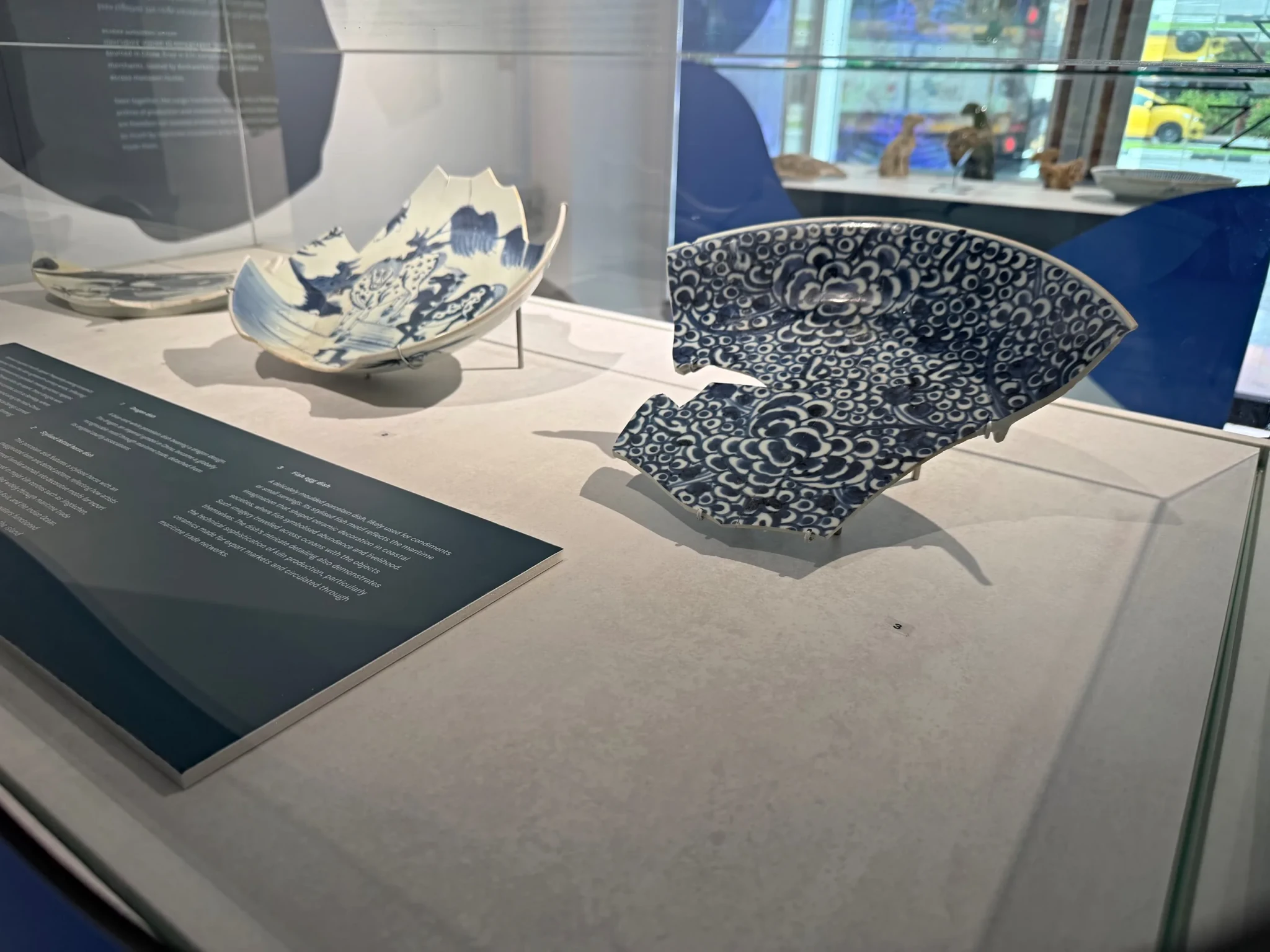 Blue-and-white porcelain fragments in a case